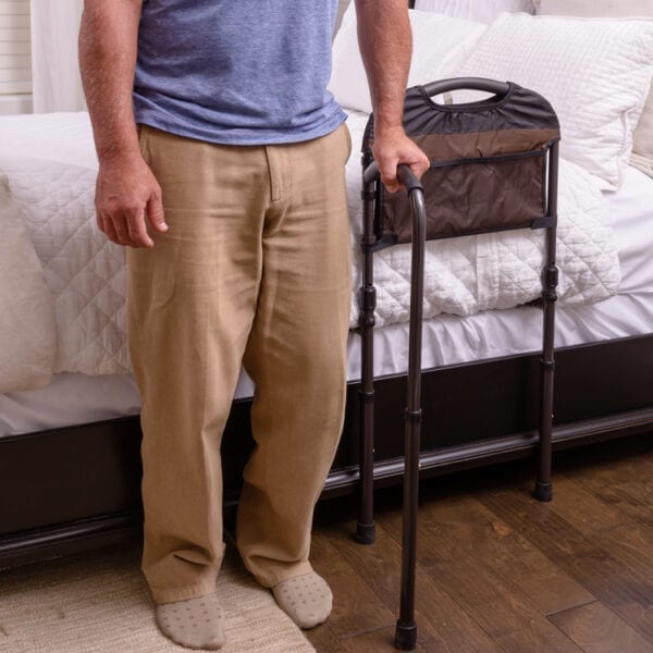 Stander Mobility Rail used by a man