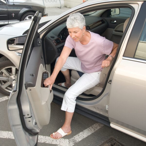 Stander Swivel Seat Cushion used by an old woman